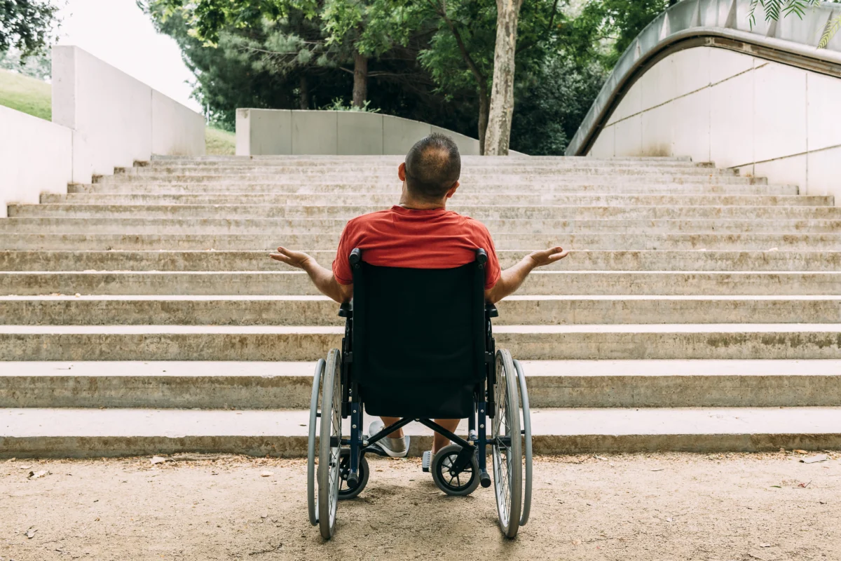 man-in-wheelchair-outraged-in-front-of-stairs